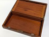 an old wooden box with two compartments open on a white surface