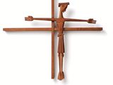 a cross made out of wood with a man on it
