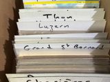a lot of books in a box with writing on them