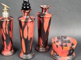 three vases and a soap dispenser sitting on a table