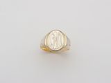 a gold signet ring with a monogram on it