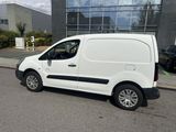 a white van that is parked on the side of the road