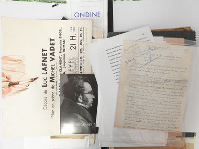 a pile of books and papers sitting on a table