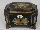 an image of a black and gold box with a number on it
