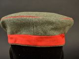 an image of a military hat with a red band on it