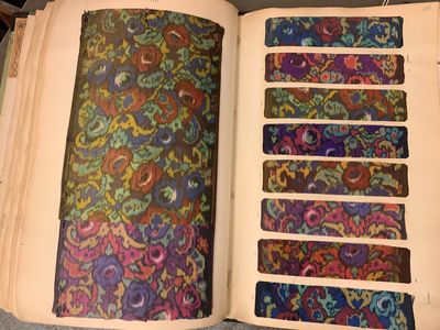 an open book that has a bunch of different designs on it