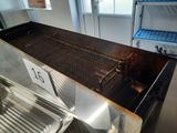 a large grill with a number on it in a kitchen