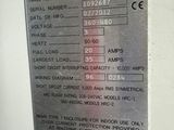 a picture of a metal sign on the wall of a machine shop