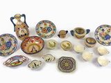 many different types of dishes and bowls on the table