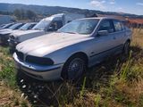 many cars that are parked in a field together