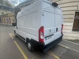 a white van that is parked on the side of the street