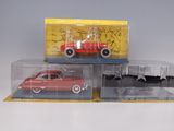 a red car and a red car in a display case