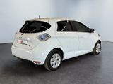a picture of a white car parked in a room