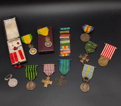 several medals and medals are displayed on a black surface
