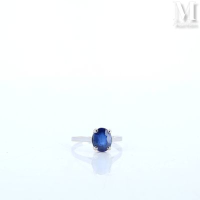 an image of a sapphire ring on a white surface