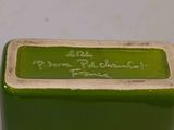 a small green box with writing on it