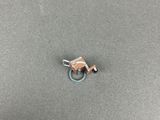 a close up of a small metal object on a table