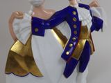 a figurine of a man and a woman dancing