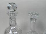 three glass vases sitting next to each other on a table