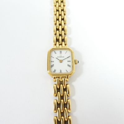 an image of a close up of a wrist watch on a white surface