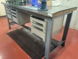 a workbench with a lot of drawers and drawers on it