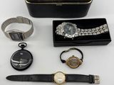 an assortment of watches and a watch case on a table