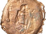 an image of a gold coin with an image of a man and a woman on it