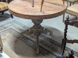a wooden table with a clock on it in a room