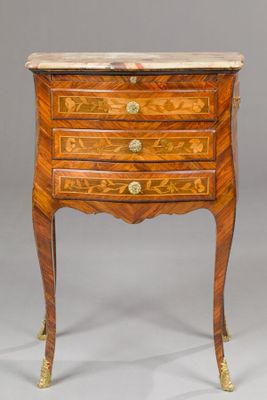 une petite commode de style Louis II en noyer et marbre marqueté