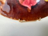 a plate with a flower on it on a table