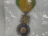 the medal is in the plastic bag on the table