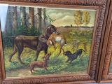 two paintings of animals that are on display in a room