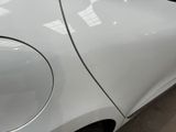 a close up of a car ' s side door with a sticker on it