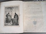 an old book with a picture of a man and a woman standing in front of a tree