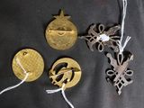 several different types of metal items are laid out on a black surface