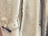 a coat hanging on a rack in a clothing store