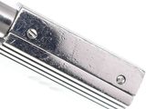 a close up of a metal object on a white surface
