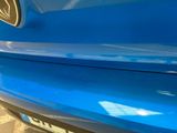 a close up of a car ' s bumper with a sticker on it
