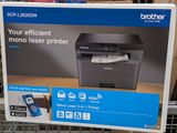 the box of the printer is on the shelf in the store