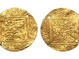 two gold coins with arabic writing on them