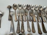 a lot of spoons and spoon spoons on the table