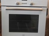 a white oven that is sitting in a box