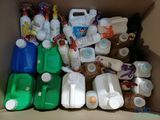 a cardboard box filled with various types of milk