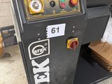 a machine that is sitting on the ground in the garage