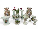 many vases that are sitting on a white surface