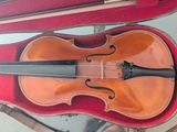 an old violin in a case sitting on a table