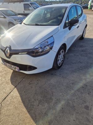 a white car parked in a parking lot next to other cars