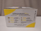 packaging of a yellow and white box sitting on a white table