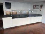 a glass display case in the middle of a room
