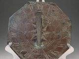 a large clock with roman numerals on it ' s face